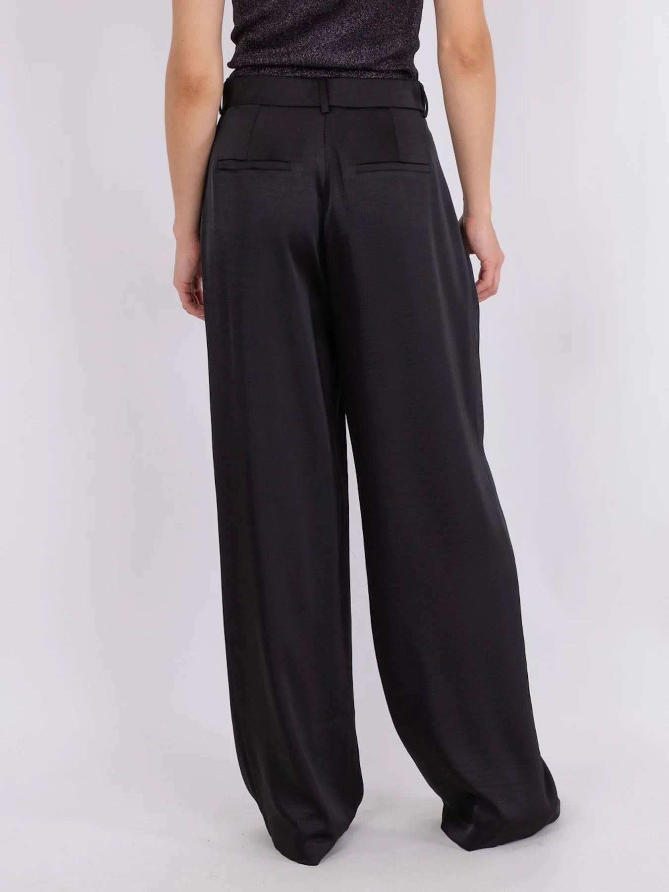 Back view of Neo Noir Alessandra Heavy Sateen Pants – Black, women's fashion wide-leg trousers in premium satin.
